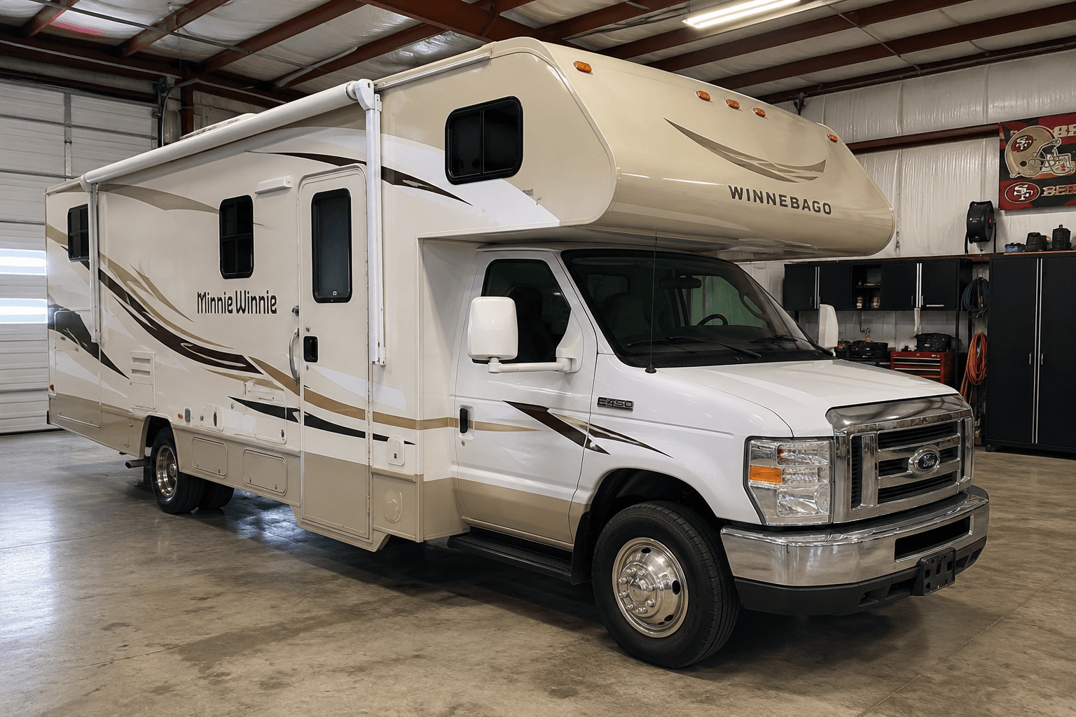 2013 Winnebago Minnie Winnie Class C motorhome on Ford E-450 chassis, white and tan exterior with Minnie Winnie graphics and cab-over sleeping cabin