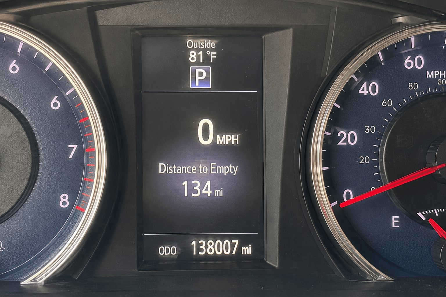 Example photo: odometer reading 138,007 miles on a 2017 Toyota Camry, photographed for an online title loan