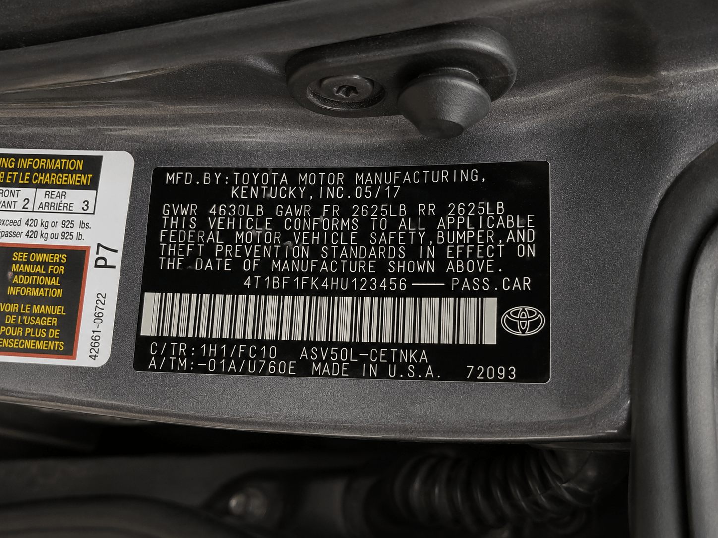 Example photo: VIN plate on the driver door jamb of a 2017 Toyota Camry, photographed for online title loan verification